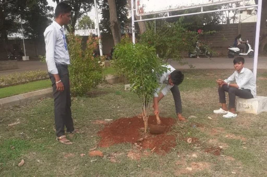 NSS volunteers participating in a tree plantation drive for environmental awareness
