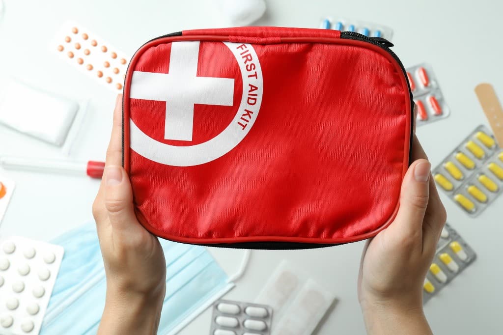 Red first-aid kit with medical supplies at BIHE campus