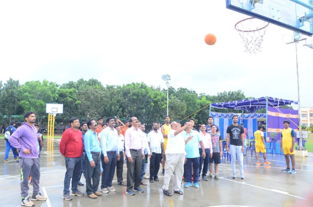 BIHE faculty and students at a basketball court inauguration on campus