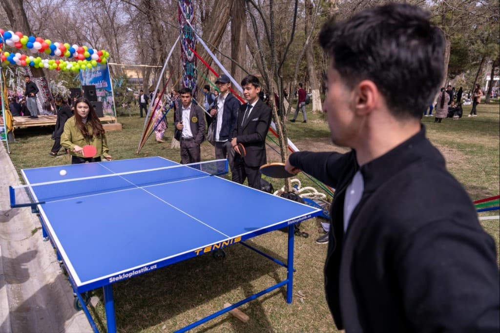 Students playing table tennis at an inter college event